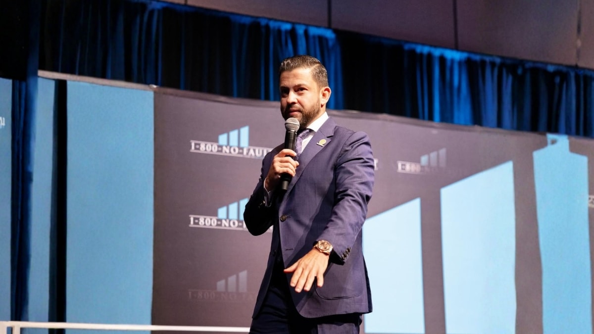 Christian Alexander Delgado speaking at 1-800-No-Fault corporate event